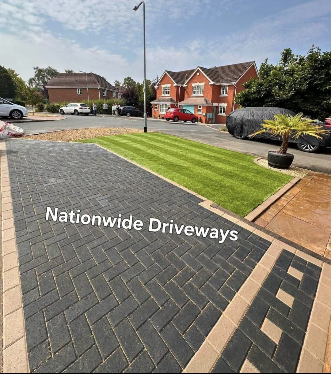Block paving driveway with artificial grass